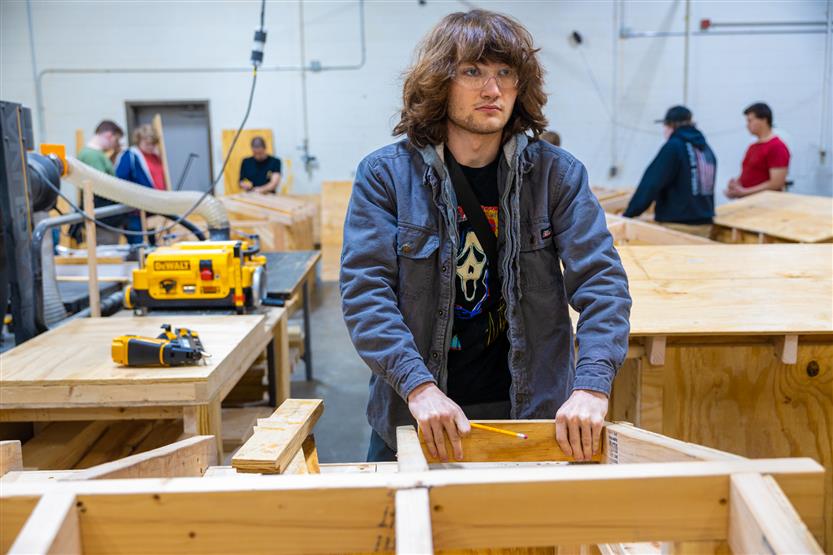 Students build doghouses